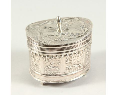 A GOOD DUTCH OVAL SILVER TEA CADDY with hinged cover, all repousse with flowers and animals. 7cms wide x 3cms high.