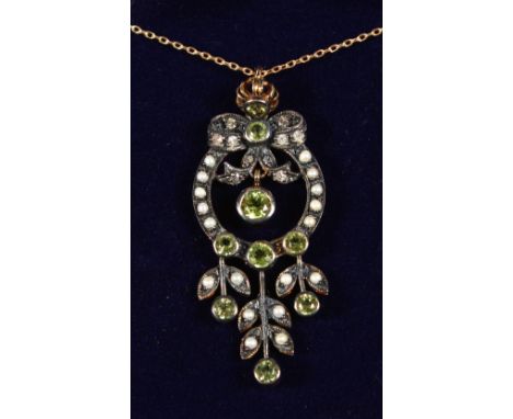 A 9CT GOLD AND SILVER PERIDOT, PEARL AND DIAMOND PENDANT on a chain, boxed.