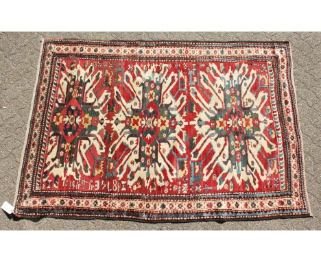 A RARE CAUCASIAN CHELEBERD RUG with Eagle design. 7ft x 4ft 10ins.