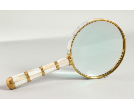 A MOTHER-OF-PEARL HANDLED MAGNIFYING GLASS.
