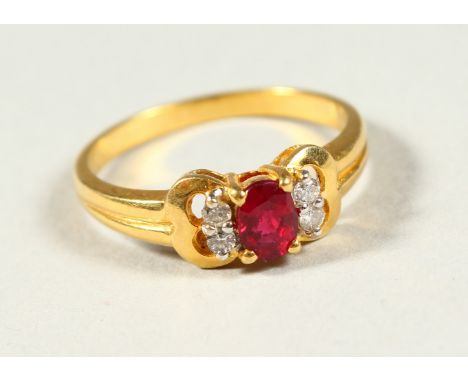 AN 18CT GOLD, DIAMOND AND RUBY RING.