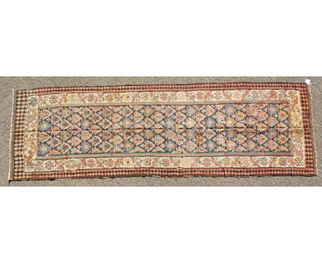 A PERSIAN QAZVIN KILIM CARPET. 11ft 3ins x 3ft 8ins.