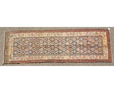 A PERSIAN QAZVIN KILIM CARPET. 11ft 3ins x 3ft 8ins.