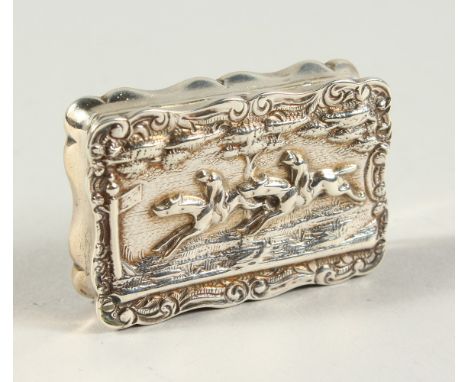 A VICTORIAN SNUFF BOX AND COVER, the lid repousse with two race horses and jockeys. Birmingham 1896. Maker C. S. &amp; F.S. 2