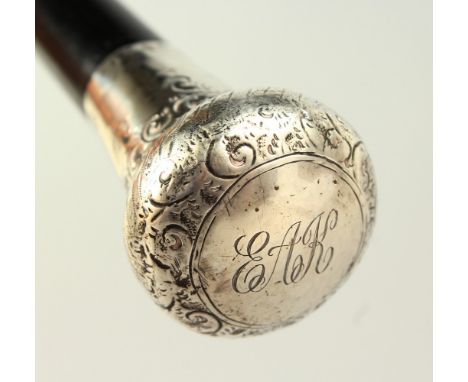 AN EARLY 20TH CENTURY WALKING STICK with engraved silver handle. 95cms long.