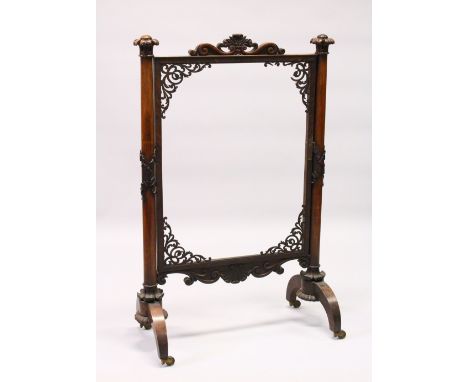 A VICTORIAN ROSEWOOD FRAMED FIRESCREEN with turned side columns (AF). 120cms high x 78cms wide.