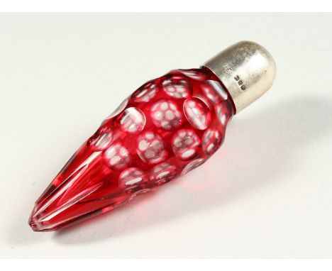 A VICTORIAN RUBY TINTED TAPERING GLASS SCENT BOTTLE with plain screw off silver top. Birmingham 1886. Maker C. M. 10cms long.