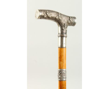 A WALKING STICK with Burmese silver handle. London 1908. 2ft long.