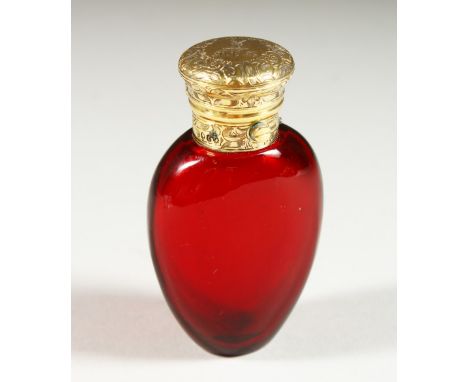 A GOOD VICTORIAN RUBY GLASS SCENT BOTTLE with engraved silver gilt top with stag crest and M.P.G. London 1898. Maker W. B. 8.