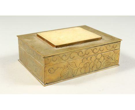 A CHINESE BOX with hinged lid, set with a circular jade piece. 5ins long.