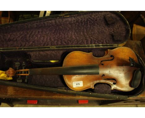 A violin in carrying case, the violin labelled "copy of Antomius Stradivarius"