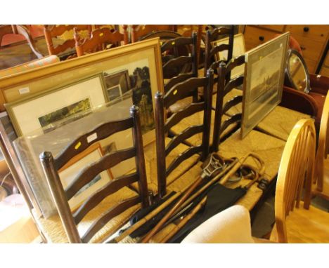 A set of eight oak and rush seated ladder back dining chairs