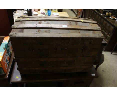 A brass and wooden bound dome topped trunk 