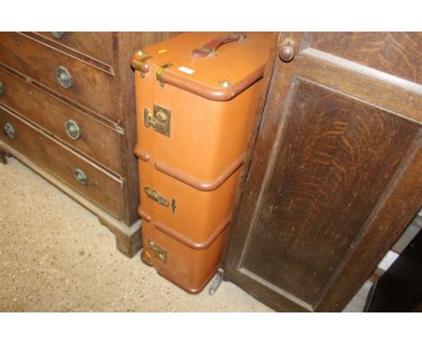 A canvas, brass and wooden bound travelling trunk 