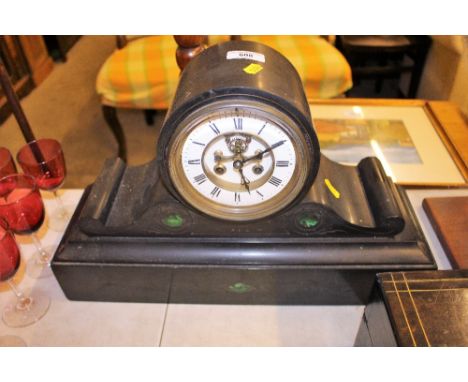 A black slate and green stone inlaid two hole mantel clock 