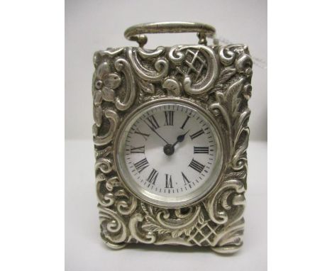 A Victorian miniature, silver cased carriage clock, having a white enamelled dial with Roman numerals, encased within a silve