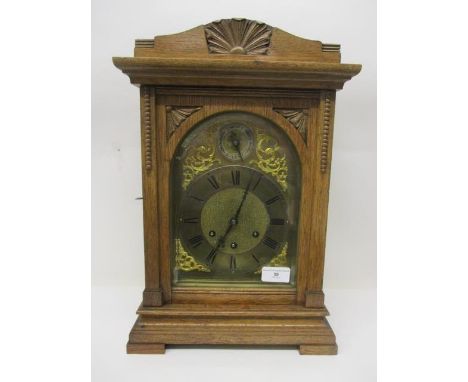 A late 19th/early 20th century oak bracket clock having an 8 day movement by Gustav Becker, gilt dial with silvered chapter r
