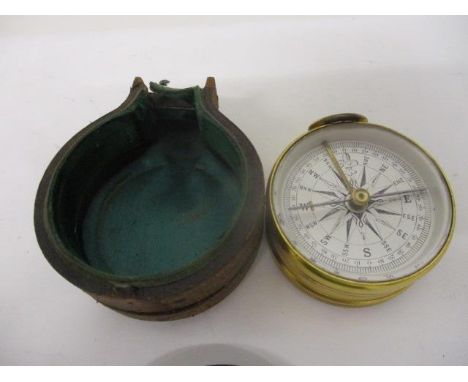 A 19th century Lascaster & Son, Birmingham, gilt metal cased compensated pocket barometer and compass, in a double opening ca