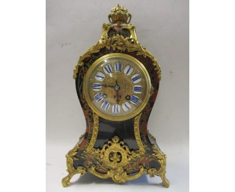 A late 19th century French Boulle work mantle clock having gilt brass, floral and scrolled mounted decoration, in a balloon s