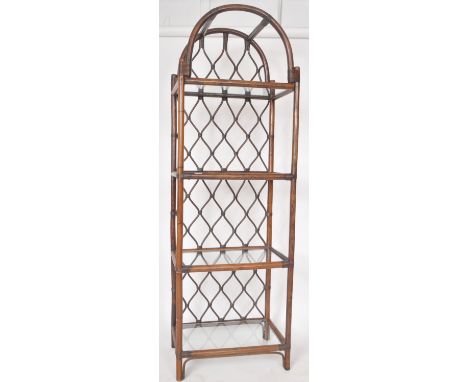 A retro vintage 20th Century stained bamboo and cane upright bookcase / display shelves having a domed top with lattice woven