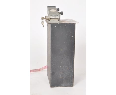 Automaticket Ltd - A vintage 20th Century bus ticket machine having a metal case and mechanism. Set to the top an Oris 8 day 