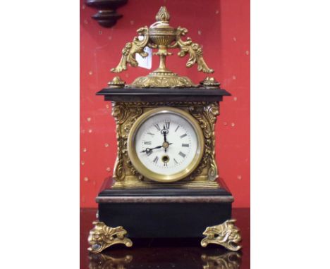 A late 19th century brass mounted mantel clock, Roman numerals