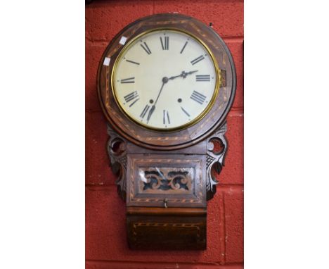 An early 20th century American oak cased drop dial wall clock, lacking pendulum