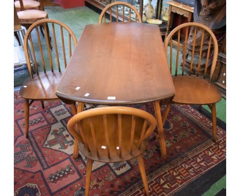 An Ercol dropleaf dining table; four conforming dining chairs (5)