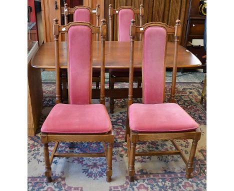 An Ercol dining table, 152cm wide; a set of four conforming dining chairs (5)