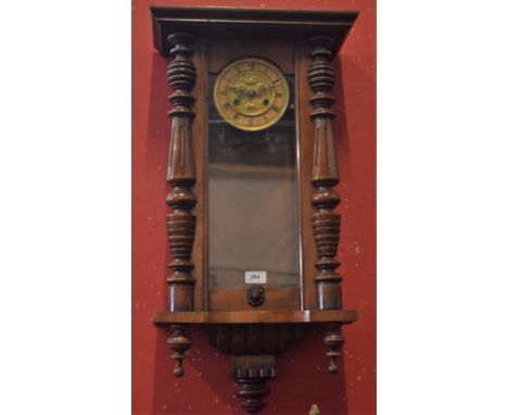 An early 20th century mahogany 'Vienna' wall clock, lacking pendulum