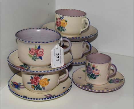 A Poole Pottery traditional pattern four setting part tea set, comprising four large cups and saucers; a similar Poole Potter