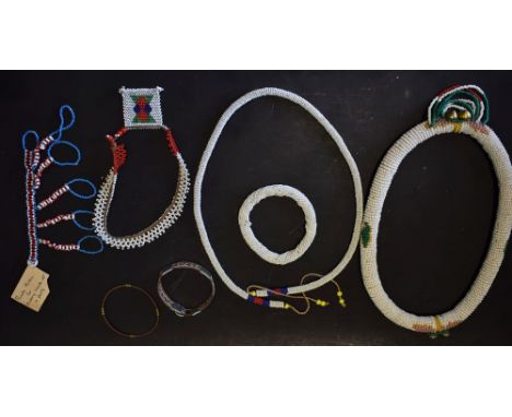 A quantity of beadwork jewellery, white beaded collar, bangle; a Pondo mitten; etc