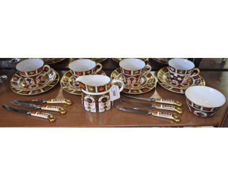 A Royal Crown Derby 1128 Imari pattern part tea service, including cups and saucers, milk jug, sugar bowl, side plates and si