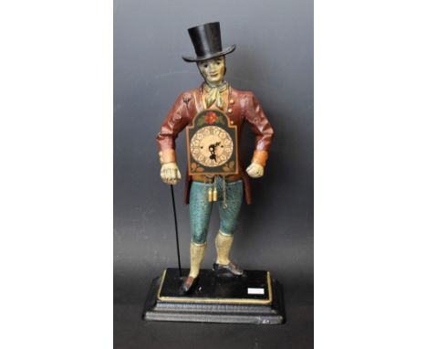 A reproduction cast iron figural clock, gentleman walking with cane and hat, approx 40.5cm high