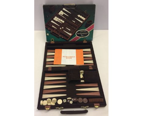 A cased & boxed Backgammon set. As New.  