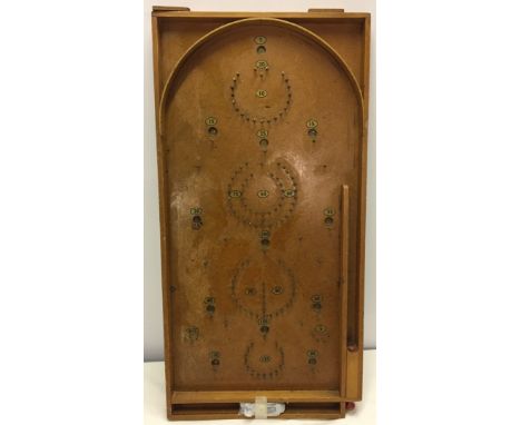 Vintage wooden bagatelle with steel balls  