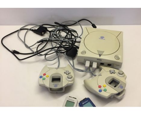 A vintage Sega Dreamcast console together with 2 hand held controls & 3 memory sticks. Complete with power cable and connecti