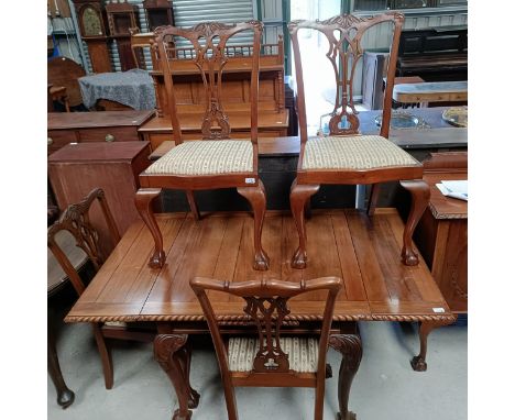 A set of four mahogany Chippendale style dining chairs, with a matching draw leaf table, 150 cm wide, and a sideboard (6)  Pl