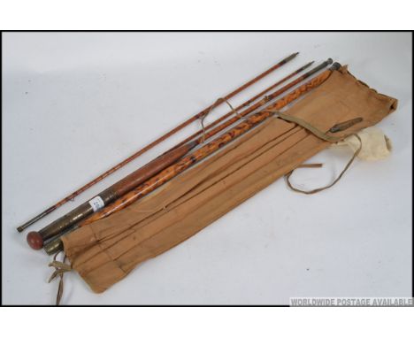 A vintage earlier half of the 20th century Army and Navy three piece split cane fly salmon / trout fishing rod, with spare ti