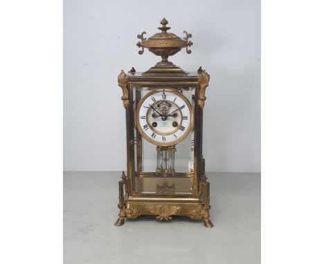 A 19th Century brass cased Mantle Clock by C. Day, Camberwell Green with urn finial, enamel chapter ring with roman numerals 