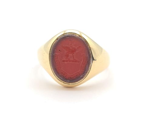 An 18ct gold Intaglio Seal Ring set carnelian carved family crest, ring size Q, approx 8.10gms 