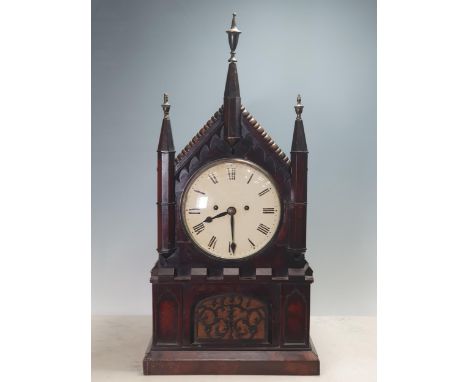 A 19th Century mahogany Gothic style Bracket Clock, with arched top, circular enamel dial and with pierced Gothic tracery pan