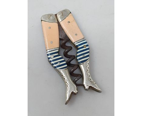 A 19th Century German novelty folding Corkscrew in the form of a pair of ladies legs in cream/pink, blue and white stockings 