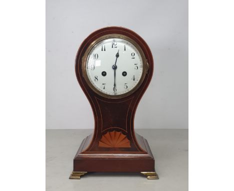 An Edwardian mahogany and fan inlaid Mantle Clock of waisted form on shaped bracket feet 12in H 