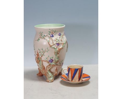 A Clarice Cliff Bizarre Coffee Can and Saucer with geometric design, and a Clarice cliff Vase moulded flowering branch design