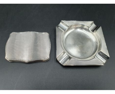 A George V continental silver Snuff Box of serpentine form with engine turning, import mark London 1928, and a square Ashtray