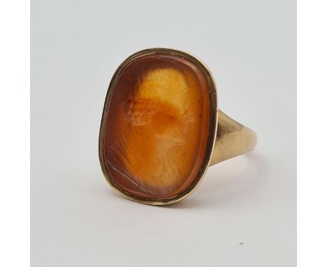An Intaglio Seal Ring the carnelian carved classical bust in profile, stamped 9ct, ring size O, approx 6.30gms 