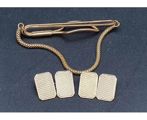 A pair of 9ct gold Cuff Links with engine turning, Birmingham 1964 and a plated Tie Clip 