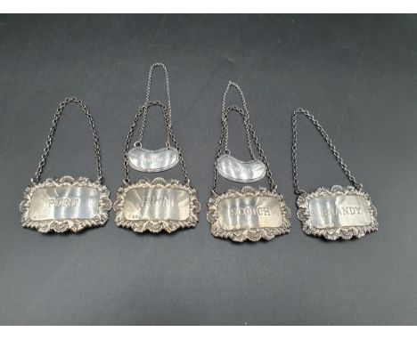 A Pair of Victorian silver Bottle Tickets for Port and Sherry of kidney shape, Sheffield 1895, and four modern Tickets Port, 