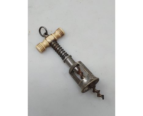 A miniature open-framed spring ladies Perfume Bottle Corkscrew with turned bone handle, 2.5in long  Handle appears to be in g